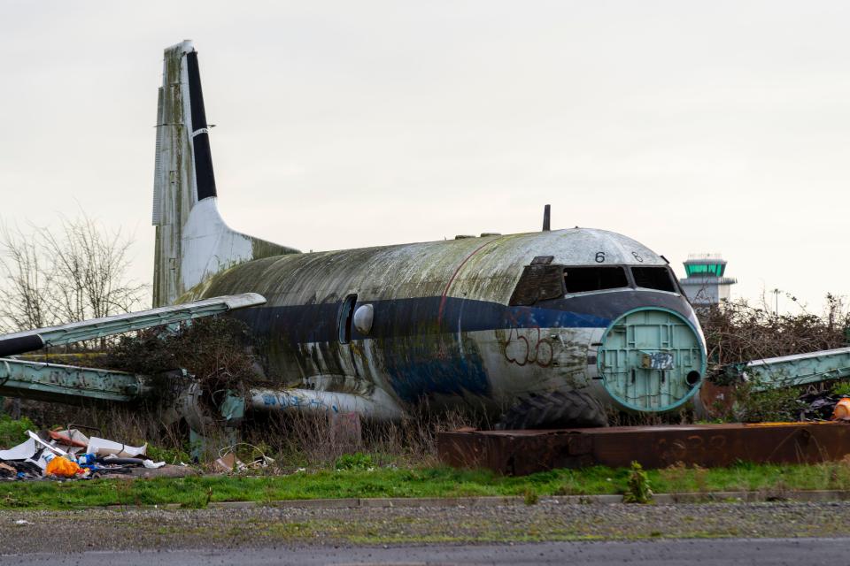 Derelict airplane at an airport.
