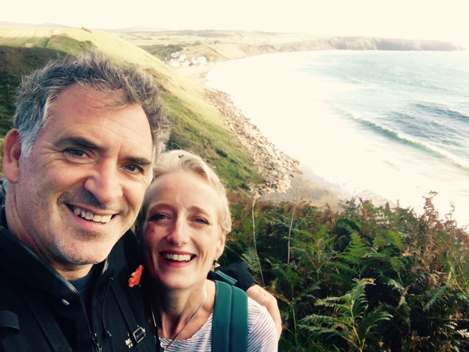 Selfie of a man and woman overlooking the ocean.