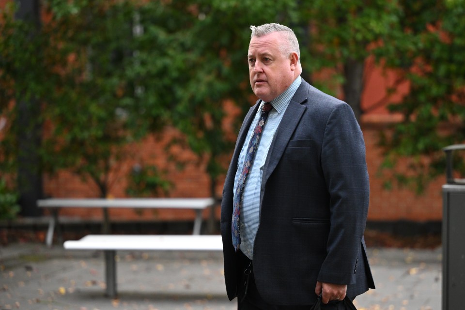 Detective Inspector Dean Thomas outside a courthouse.