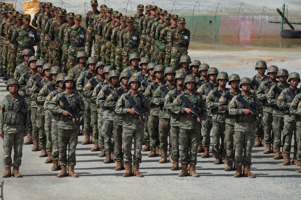 Cambodian soldiers standing in formation during a military exercise.