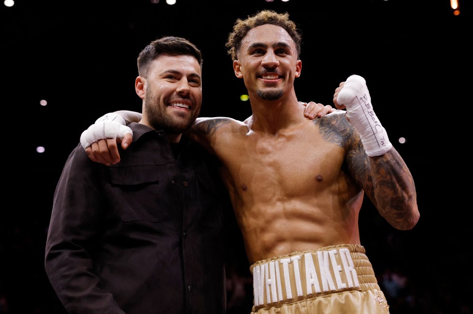 Ben Whittaker celebrates with his promoter after a boxing match.