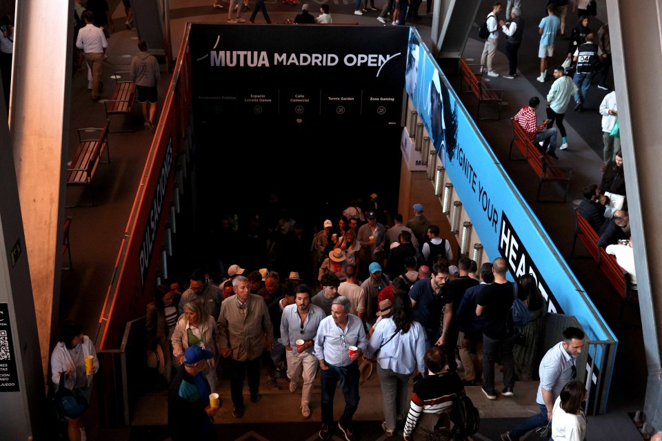 Crowd of people walking down stairs at the Mutua Madrid Open.