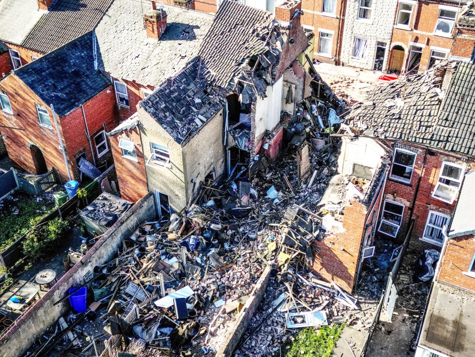 Aerial view of emergency responders at the site of a house explosion.