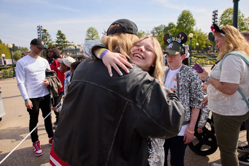Sam Ryder with Eve Wilson, 16, from the South Coast of England, pictured at the launch of the Disney Music Festival at Disneyland Paris on 26th April 2025. Ahead of World Wish Day® on 29th April, Eve joined three other inspiring young people supported by Make-A-Wish to perform alongside celebrated British singer Sam Ryder. Together, they performed Viva La Musique, the Disney Music Festival anthem, in front of Sleeping Beauty Castle. The Disney Music Festival is a new seasonal celebration running until 7th September 2025..Photographer: Daniel Kennedy