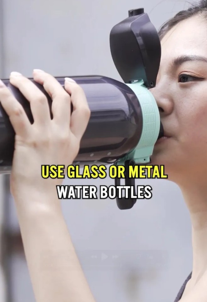Person drinking from a metal water bottle.