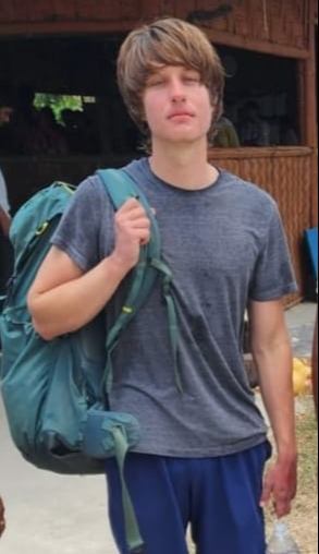 A young man with a backpack.