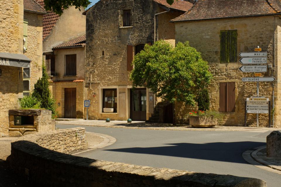 Deserted street scene in Tremolat, Dordogne, France.
