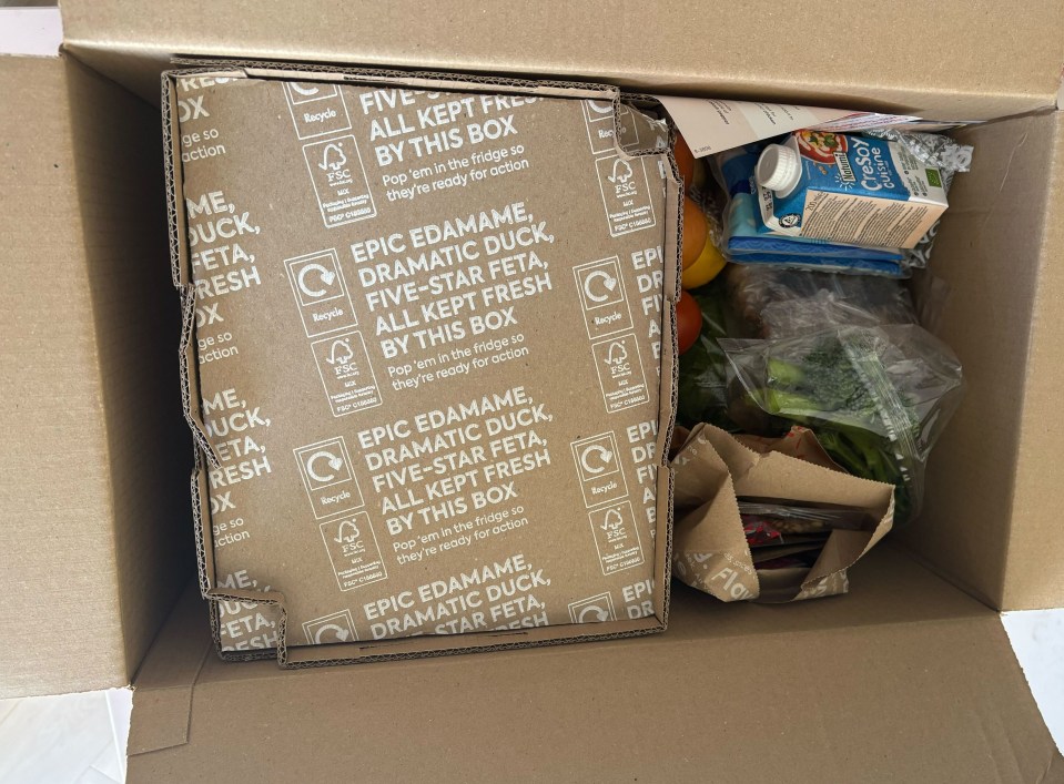 Open Gousto meal delivery box with ingredients.