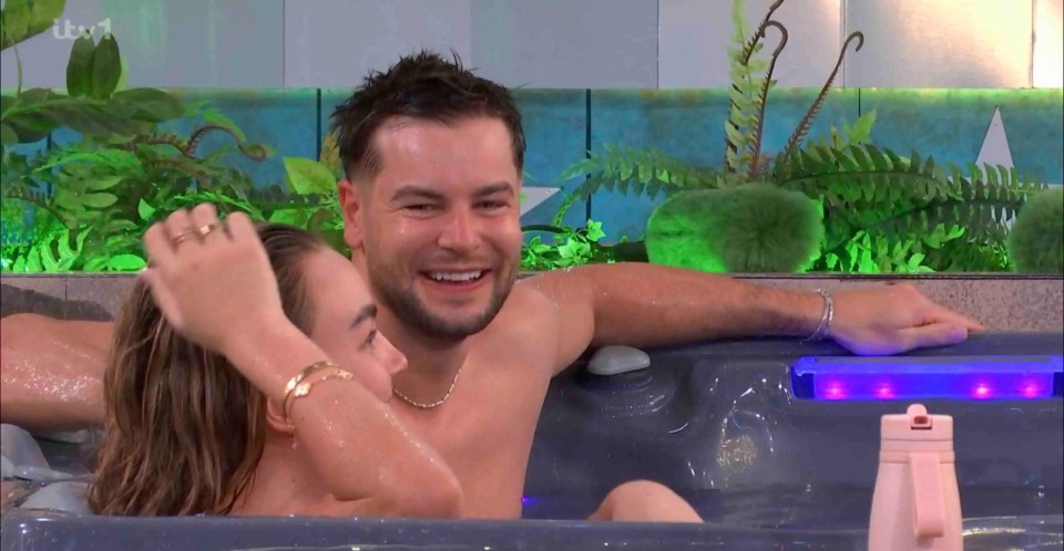 Ella Rae Wise and Chris Hughes in a hot tub.