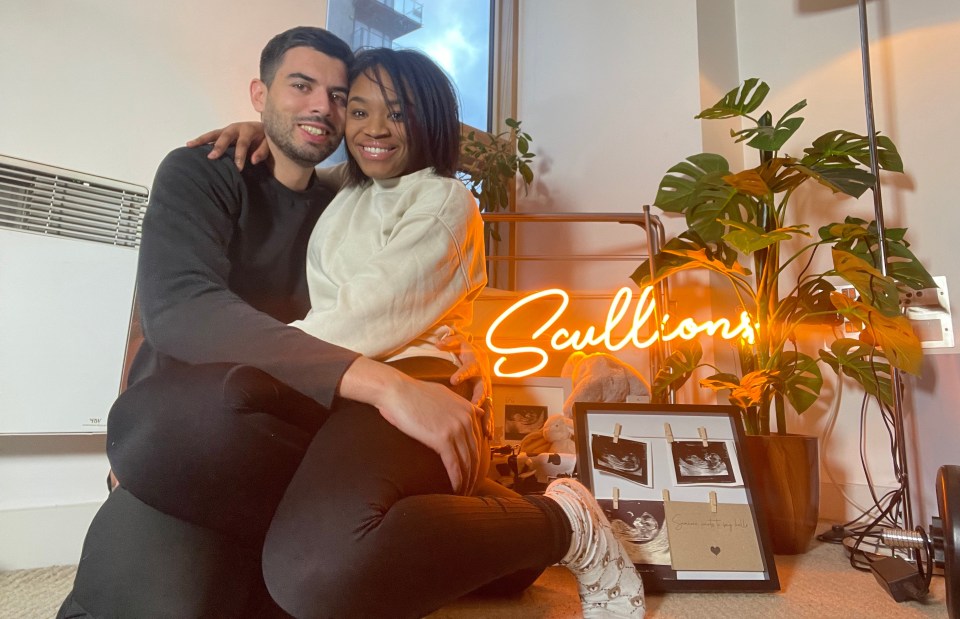 Couple embracing with ultrasound photos and a neon sign that says "Scullions".