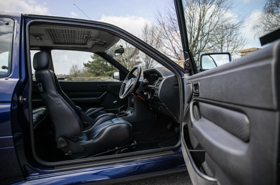Interior of a blue Ford Escort RS Cosworth Lux Big Turbo.