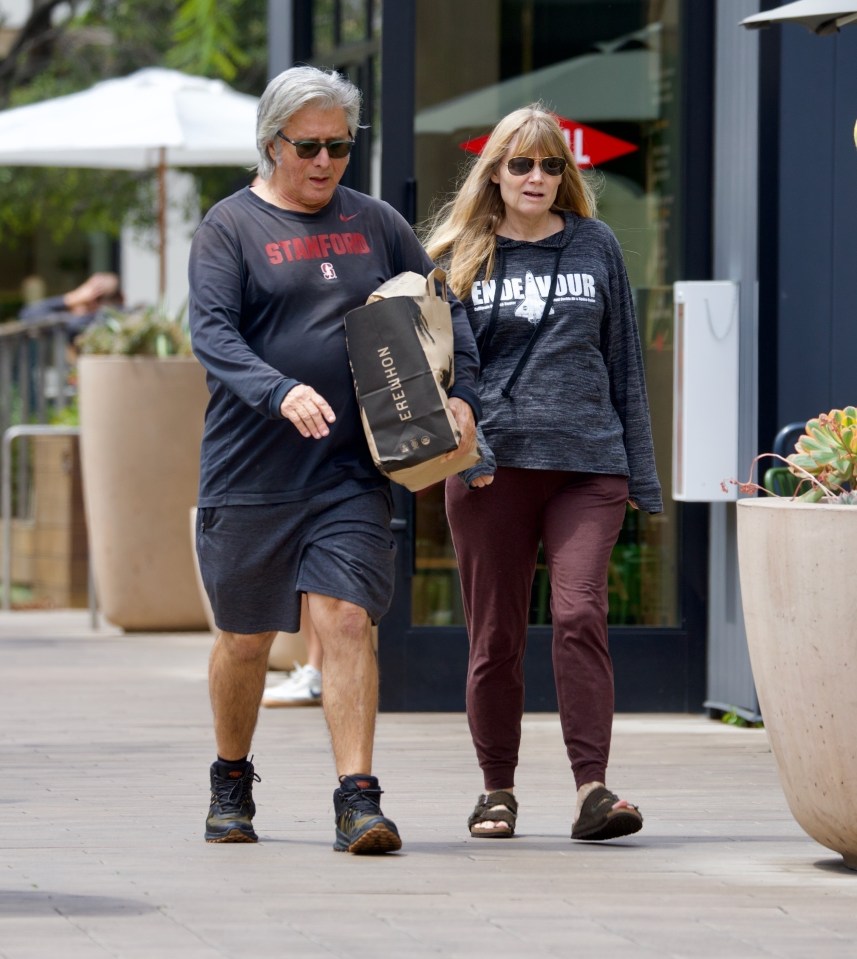 Steve Perry and Suzette Vaughn walking together.