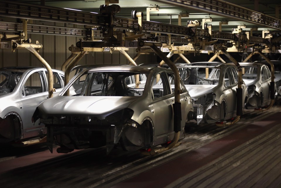 Car bodies on an automated assembly line.