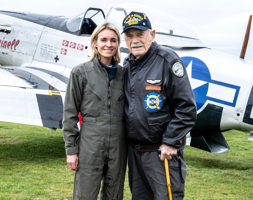 WWII veteran Joe Peterburs with a pilot in front of a Mustang fighter plane.