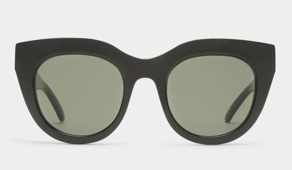 Black sunglasses with green lenses.