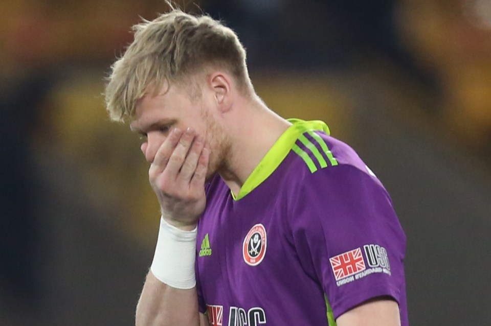 Aaron Ramsdale of Sheffield United looking upset during a soccer game.