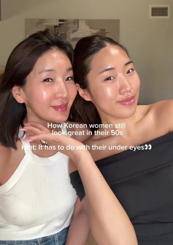 Two women, possibly a mother and daughter, discussing anti-aging techniques.