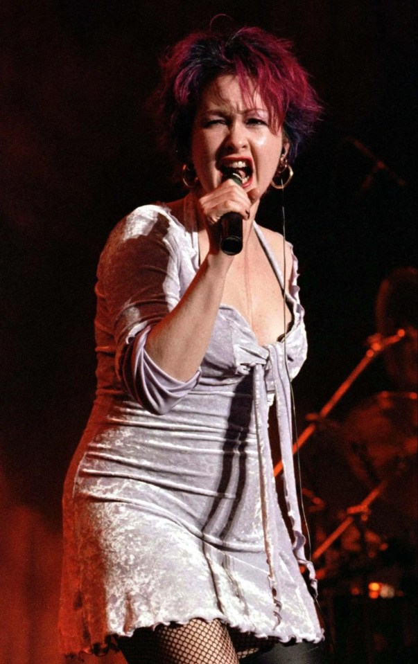 Cyndi Lauper performing on stage.