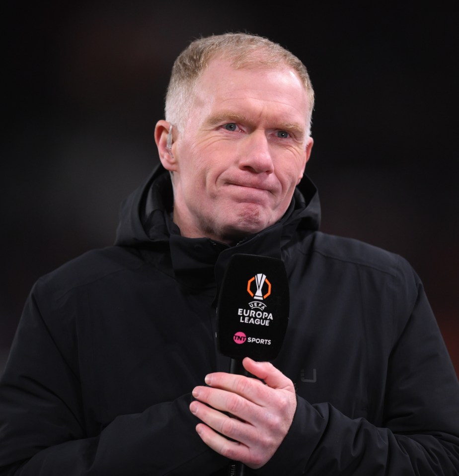 Paul Scholes holding a TNT Sports microphone during a UEFA Europa League match.