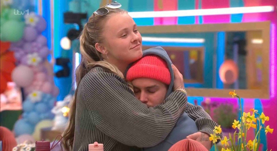 JoJo Siwa hugging Chris Hughes.