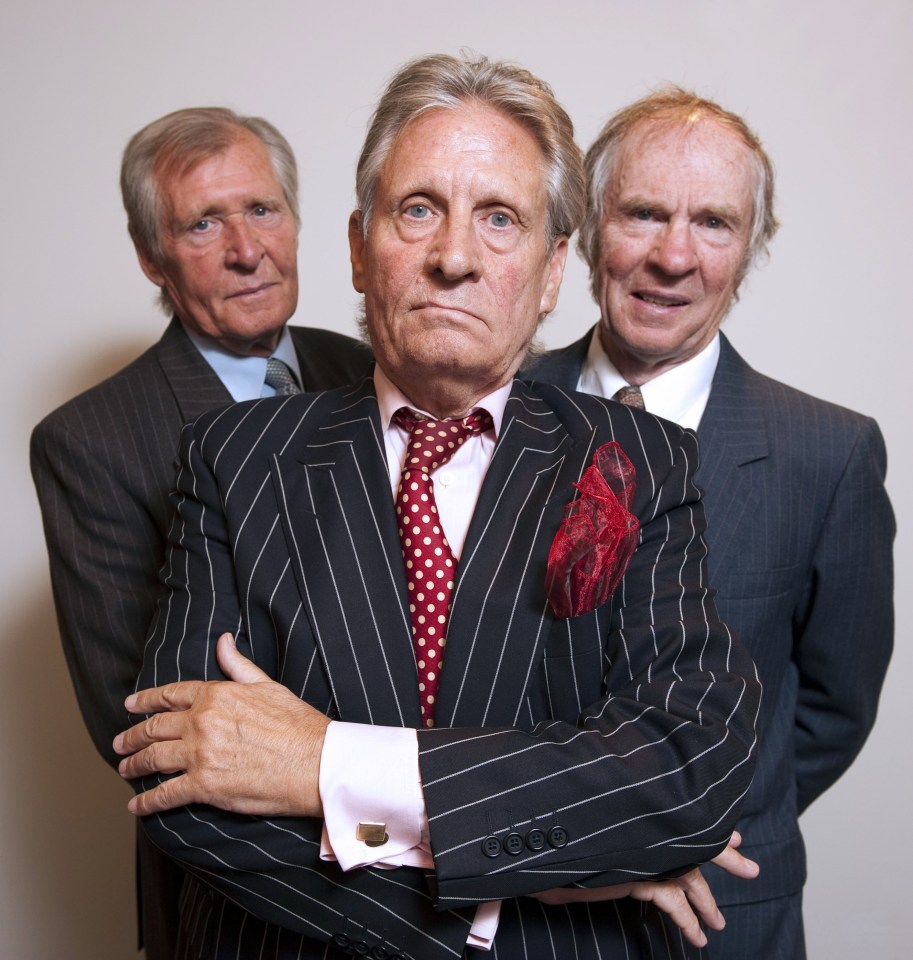 Three men in pinstripe suits.