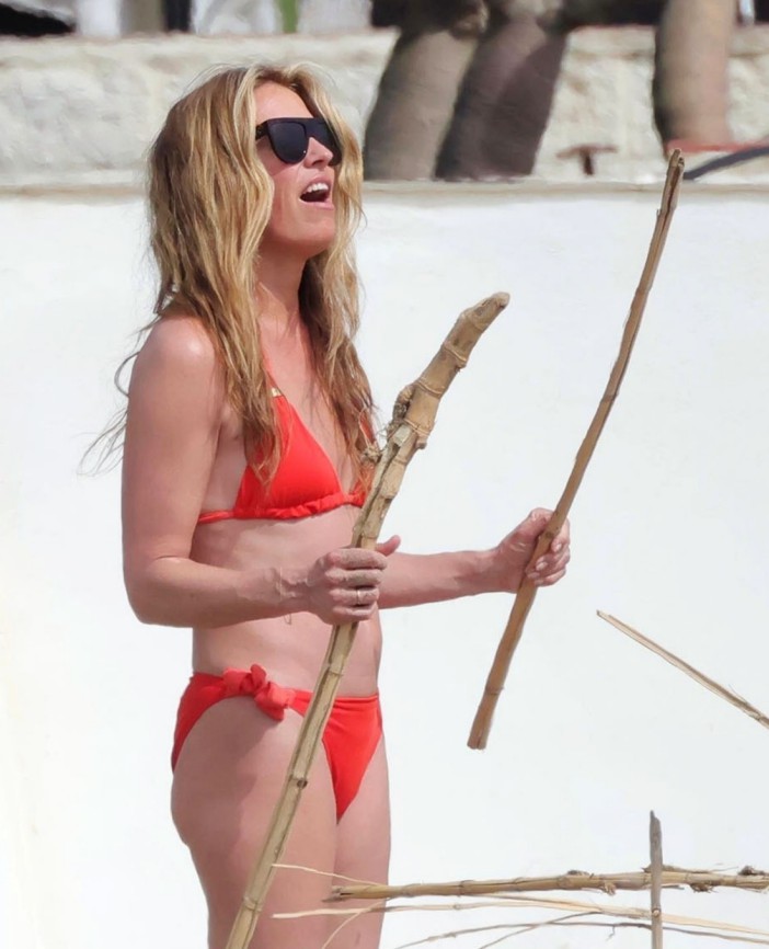 BGUK_3205975 - *PREMIUM-EXCLUSIVE* Marbella, SPAIN - MUST CALL FOR PRICING BEFORE USAGE - Enjoying a break from her hosting duties on 'This Morning', TV Presenter Cat Deeley shows off her sensational figure as she rocks in her bright red bikini during her sun-drenched holiday in Marbella. While presenters Dermot O'Leary and Sian Welby stand in for Cat and her co-star Ben Shephard back home on the popular daytime show, the 48-year-old, mum-of-two is seen swapping the ITV Studios for some warm Spanish sunshine. Pictured: Cat Deeley BACKGRID UK 10 APRIL 2025 UK: +44 208 344 2007 / uksales@backgrid.com USA: +1 310 798 9111 / usasales@backgrid.com *Pictures Containing Children Please Pixelate Face Prior To Publication*
