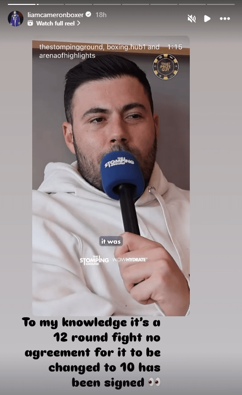 Man speaking into a microphone during an interview.