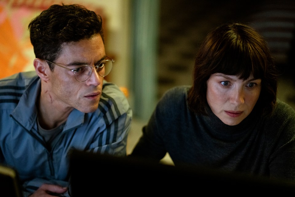Rami Malek and Caitriona Balfe in a scene from "The Amateur."