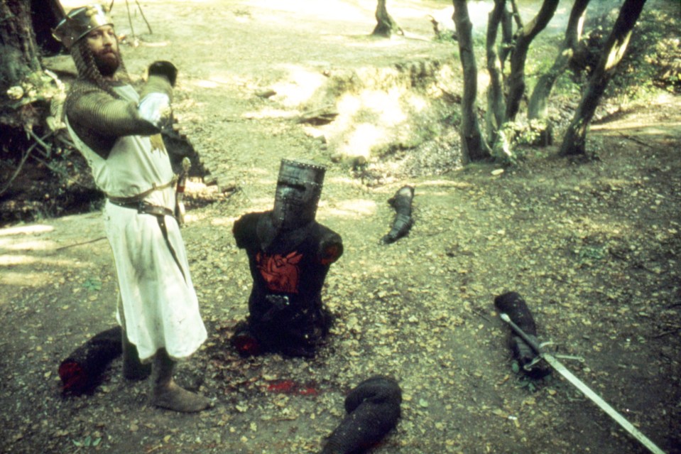A knight in a forest beheads a dummy.