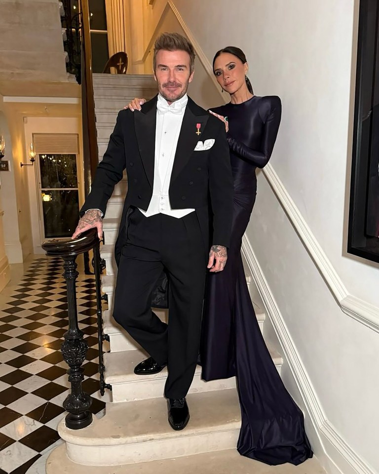 David and Victoria Beckham on a staircase.