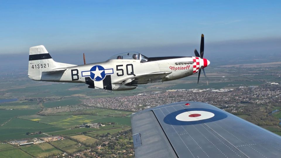 A restored North American P-51 Mustang, named 'Marinell', in flight.