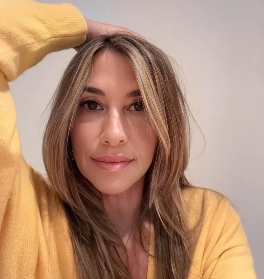 Melanie Blatt in a yellow sweater.