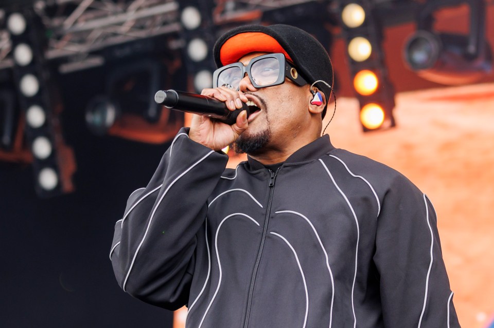 Apl.de.Ap of the Black Eyed Peas performing on stage.