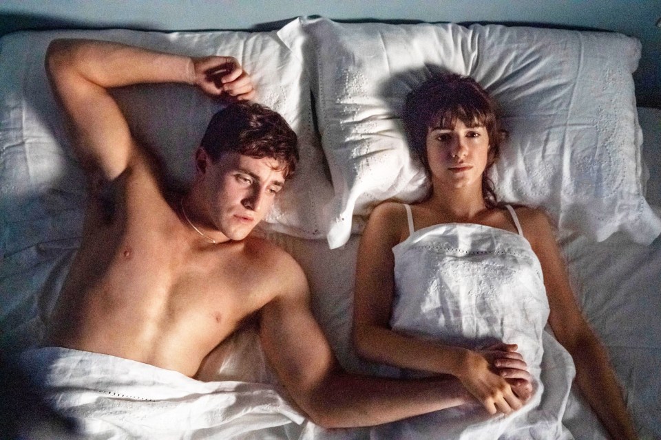 Connell and Marianne from Normal People lying in bed together.