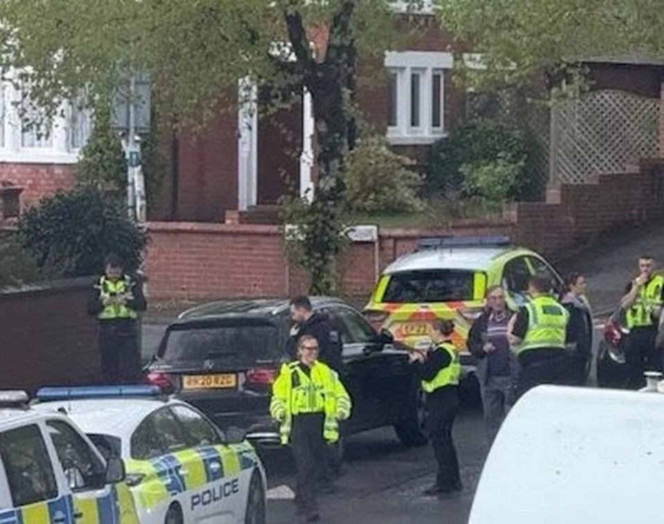 Police officers investigating the disappearance of a businesswoman at the scene where her abandoned Mercedes was found.