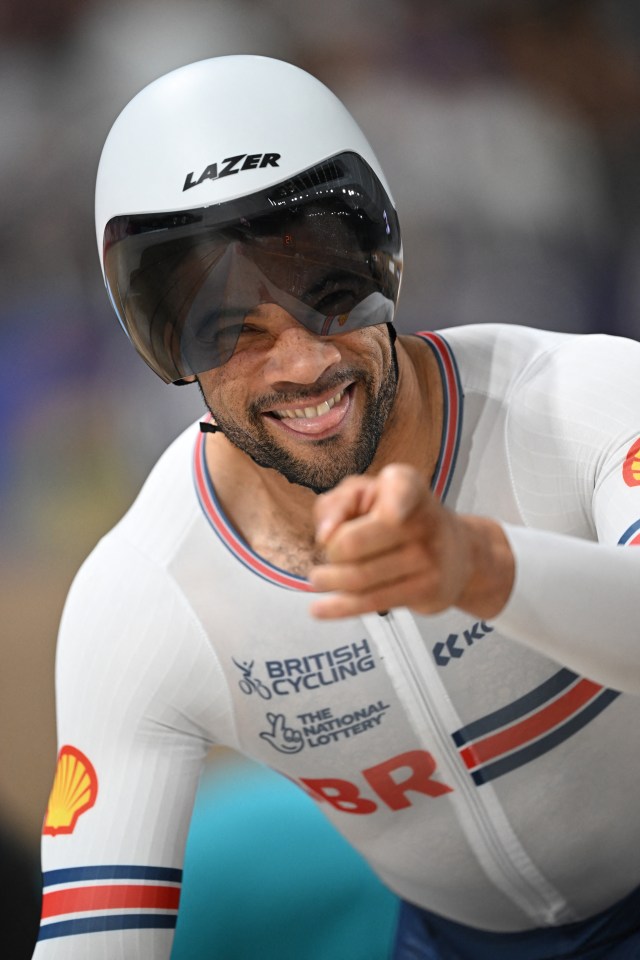 Sam Ruddock celebrating his win at the Cycling World Championships.