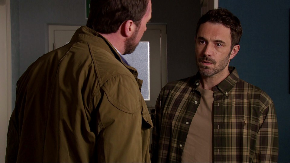 Two men having a serious conversation.