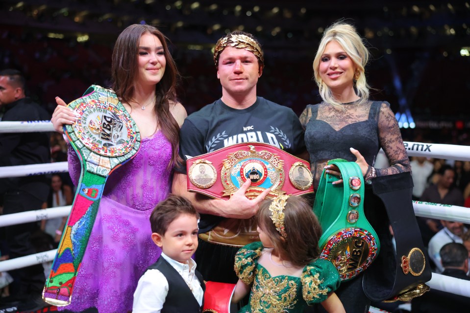 Canelo Alvarez celebrates his boxing victory with his family and championship belts.