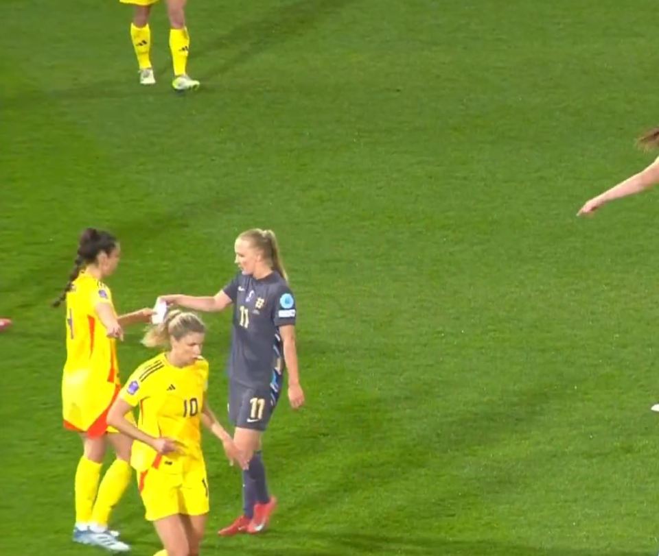 Female soccer players on a field.