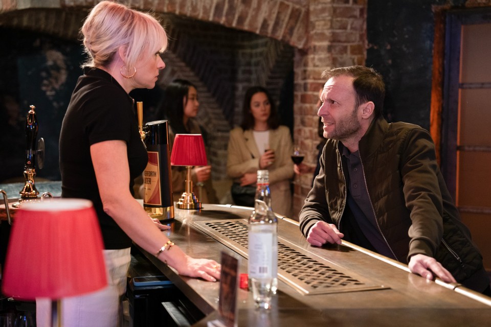 Scene from EastEnders: Nicola and Benji at a bar.