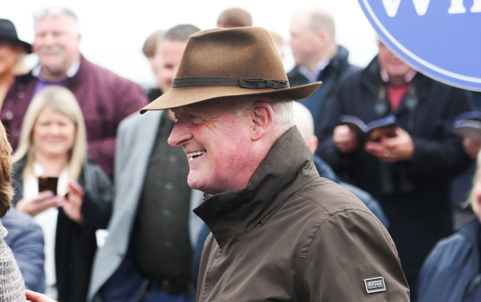 Trainer Willie Mullins celebrates a horse race win.