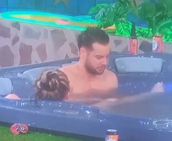 JoJo Siwa and Chris Hughes in a hot tub.