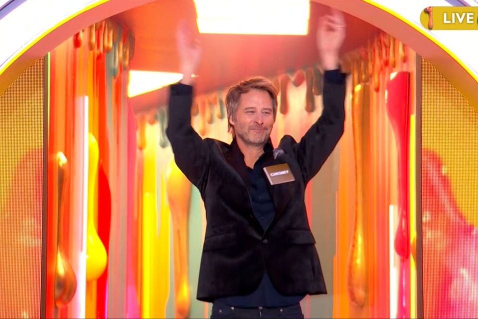 An image collage containing 1 images, Image 1 shows Man celebrating in colorful doorway