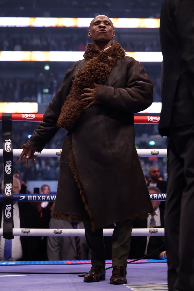 Chris Eubank Sr. bowing before a boxing match.