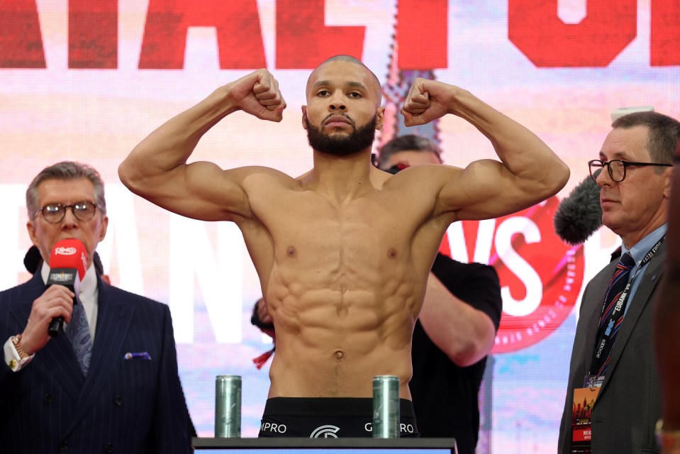 Chris Eubank Jr. flexing at a weigh-in.
