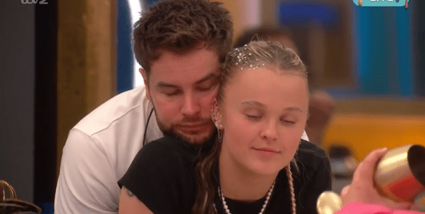 Chris Hughes and JoJo Siwa in a close embrace.
