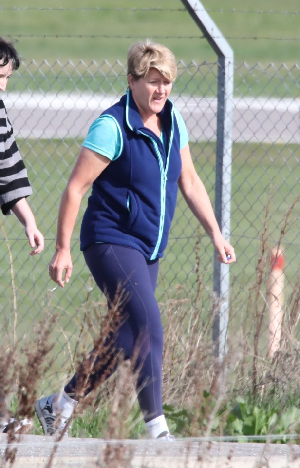 Claire Balding walking outside a hotel.