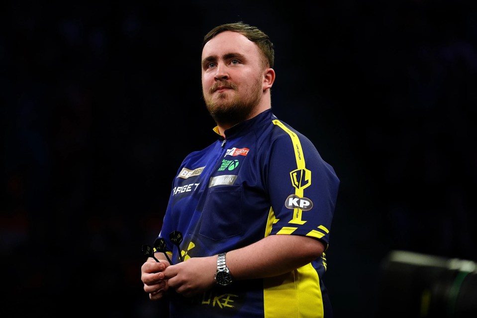 Luke Littler at a darts match.