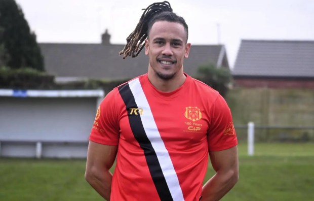 Man in red rugby shirt.