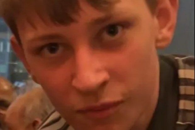 Close-up of a boy with short brown hair.